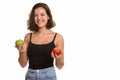 Young happy Caucasian teenage girl smiling holding red and green Royalty Free Stock Photo