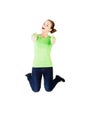 Young happy caucasian woman jumping in the air with thumbs up Royalty Free Stock Photo