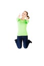 Young happy caucasian woman jumping in the air with thumbs up Royalty Free Stock Photo