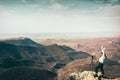 Young happy caucasian woman travel photographer excited shooting landscape outdoors Royalty Free Stock Photo