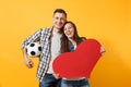 Young happy cheerful couple supporter, woman man, football fans cheer up support team, holding red heart love, soccer Royalty Free Stock Photo