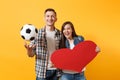 Young happy cheerful couple supporter, woman man, football fans cheer up support team, holding red heart love, soccer Royalty Free Stock Photo