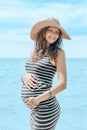 Young happy cheerful pregnant woman smilling and enjoing life in