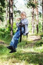 Young happy child boy in adventure park. Royalty Free Stock Photo