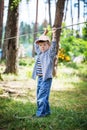 Young happy child boy in adventure park. Royalty Free Stock Photo