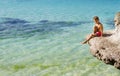 Young happy child boy on rocks on tropical sea backgroun Royalty Free Stock Photo