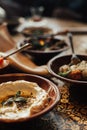 Young happy company of people is eating lebanon food and smokinh shisha. Lebanon cuisine. Traditional meze lunch Royalty Free Stock Photo