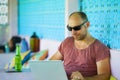 Young happy and confident backpacker man working with laptop computer outdoors relaxed as freelance entrepreneur and digital nomad Royalty Free Stock Photo