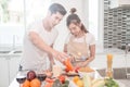 Young happy couple cooking together in the kitchen at home Royalty Free Stock Photo