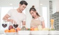 Young happy couple cooking together in the kitchen at home Royalty Free Stock Photo