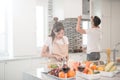 Young happy couple cooking together in the kitchen at home Royalty Free Stock Photo