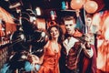 Young Happy Couple in Costumes at Halloween Party