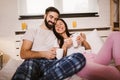 Happy couple drinking coffee in bed at morning Royalty Free Stock Photo