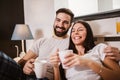 Happy couple drinking coffee in bed at morning Royalty Free Stock Photo