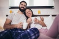 Happy couple drinking coffee in bed at morning Royalty Free Stock Photo