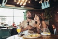 Young happy couple eating pizza in a restaurant and having fun Royalty Free Stock Photo