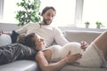 Young happy Couple expecting baby on sofa Royalty Free Stock Photo