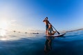 Young happy couple have fun on stand up paddleboard Royalty Free Stock Photo