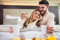 Happy couple having breakfast in luxury hotel room Royalty Free Stock Photo