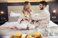 Happy couple having breakfast in luxury hotel room Royalty Free Stock Photo