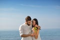 Young happy couple having date on seashore Royalty Free Stock Photo