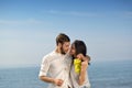 Young happy couple having date on seashore Royalty Free Stock Photo