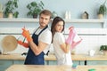 Young happy couple is having fun while doing cleaning at home Royalty Free Stock Photo