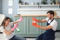 Young happy couple is having fun while doing cleaning at home Royalty Free Stock Photo