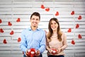 Young happy couple with heart in hands onbackground Royalty Free Stock Photo