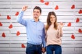 Young happy couple with heart in hands onbackground Royalty Free Stock Photo