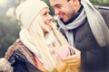 Young happy couple holding heart