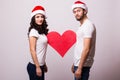 Young Happy Couple hugging and big red heart Royalty Free Stock Photo