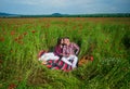 Young happy couple hugging and kissing on the poppy field, love Royalty Free Stock Photo