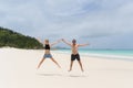 young happy couple jumping on the beach Royalty Free Stock Photo