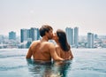 Young happy couple kissing in swimming pool Royalty Free Stock Photo