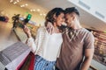 Young happy couple looking each other after shopping Royalty Free Stock Photo