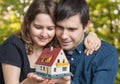 Young happy couple in love is dreaming and planning a new house Royalty Free Stock Photo