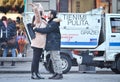 Young happy couple in love enjoying time together on street