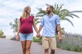 Young happy couple in love of a pregnant woman and her boyfriend walking on the street having fun on holidays. quality family time Royalty Free Stock Photo