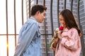 Young happy couple love and romantic at first date relationship. asian teenage woman surprise and smiling at boyfriend gives red Royalty Free Stock Photo