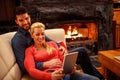 Young happy couple in love using tablet together