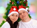 Young happy couple near Christmas tree Royalty Free Stock Photo