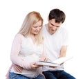 Young happy couple with photo album