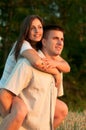 Young happy couple piggyback riding Royalty Free Stock Photo