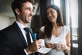 Young couple of professionals chatting during a coffee break Royalty Free Stock Photo