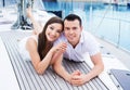 A young and happy couple relaxing on a boat Royalty Free Stock Photo
