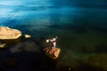 Young happy couple relaxing on the rock on the beach, Black Sea, Odessa, Ukraine, place for text, top view, set Royalty Free Stock Photo