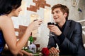 Young happy couple romantic date drink glass of Royalty Free Stock Photo