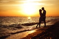 Young happy couple on seashore. Royalty Free Stock Photo