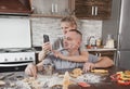 a young happy married couple smeared with flour takes a selfie in the kitchen Royalty Free Stock Photo